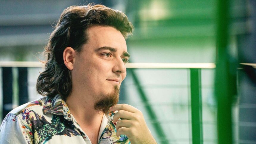 Palmer Luckey strokes his goatee.