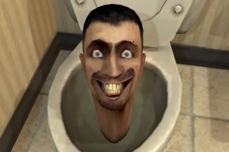 A grinning head in a toilet