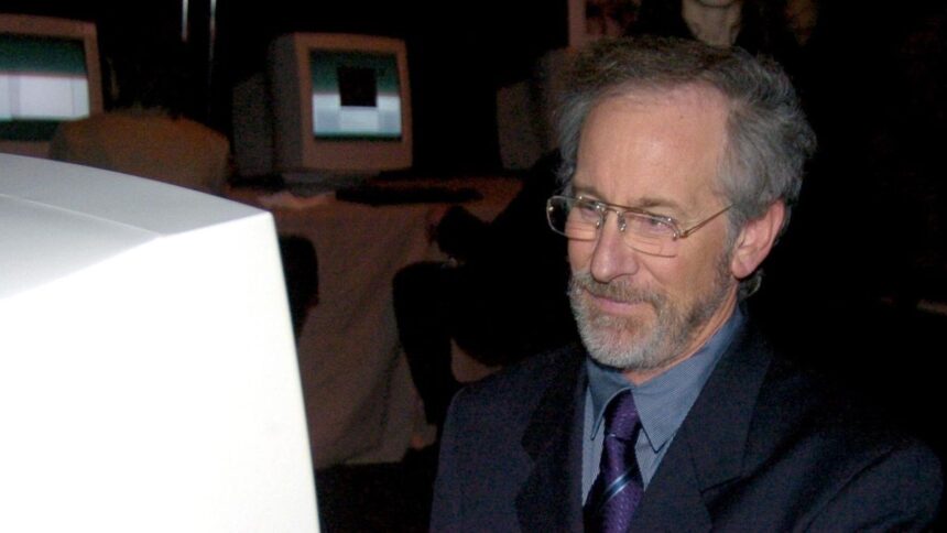 Steven Spielberg looking at a PC.