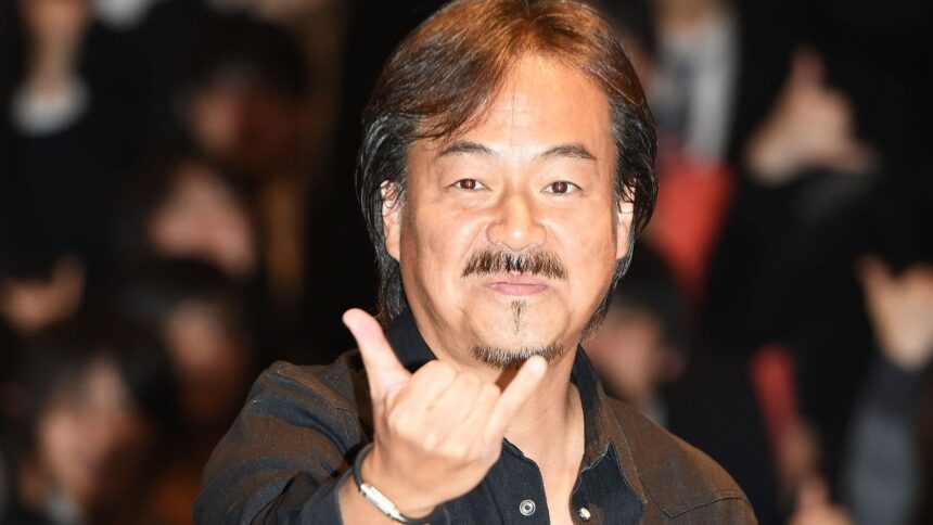 Hironobu Sakaguchi makes a hand gesture.