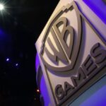 The WB Games logo is displayed during the E3 Electronic Entertainment Expo in Los Angeles, California, U.S., on Wednesday, June 17, 2015. E3, a trade show for computer and video games, draws professionals to experience the future of interactive entertainment as well as to see new technologies and never-before-seen products. Photographer: Patrick T. Fallon/Bloomberg via Getty Images