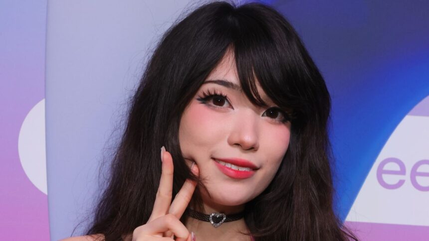 The streamer Emiru gives the peace sign to camera.