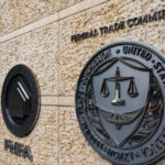 The seals of the Federal Housing Finance Association (FHFA) and the Federal Trade Commission (FTC) at the organizations' headquarters in Washington, DC, US, on Monday, May 20, 2024. Earlier this month, the Federal Deposit Insurance Corp., the Office of the Comptroller of the Currency, and the Federal Housing Finance Agency announced that they had taken an initial step toward imposing the long-delayed Dodd-Frank Act rule, which would force banks to claw back some pay from executives taking on too much risk. Photographer: Al Drago/Bloomberg via Getty Images
