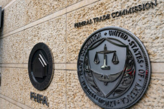 The seals of the Federal Housing Finance Association (FHFA) and the Federal Trade Commission (FTC) at the organizations' headquarters in Washington, DC, US, on Monday, May 20, 2024. Earlier this month, the Federal Deposit Insurance Corp., the Office of the Comptroller of the Currency, and the Federal Housing Finance Agency announced that they had taken an initial step toward imposing the long-delayed Dodd-Frank Act rule, which would force banks to claw back some pay from executives taking on too much risk. Photographer: Al Drago/Bloomberg via Getty Images