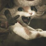 A Palico with its mouth open in a manic grin in Monster Hunter Wilds.