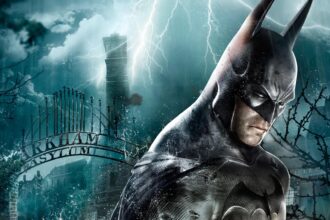 Batman the superhero standing in front of Arkham Asylum's gates in the rain.