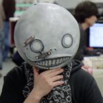 NieR creator Yoko Taro in his trademark Emil mask from the games