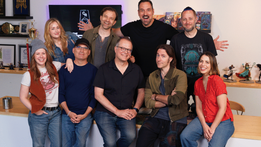 An image of the Critical Role crew posing with senior designers Jeremy Crawford and Chris Perkins, former employees of Wizards of the Coast.