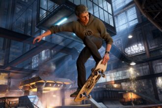 Tony Hawk from the new remake of Tony Hawk's Pro Skater 3+4. He's jumping in the air with his skateboard, holding onto the front as he prepares to land.